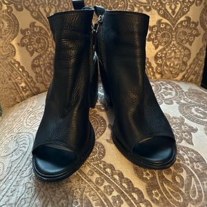 Black peep toe rocker style platform sandal with zipper detail